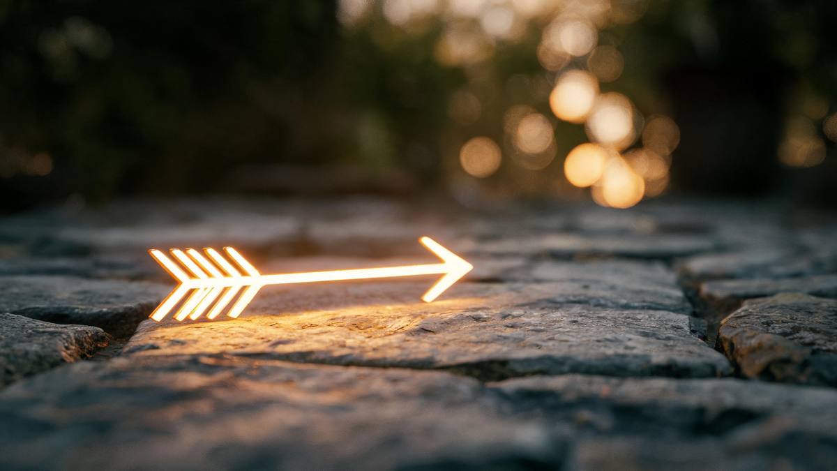 A single glowing arrow lying on a stone surface, soft warm light, no people