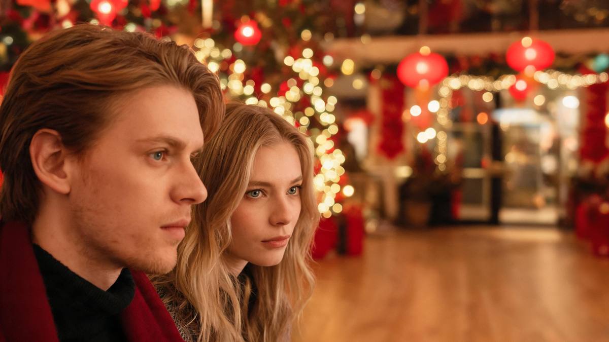 A warm festive interior with red lantern-style bokeh and an empty floor