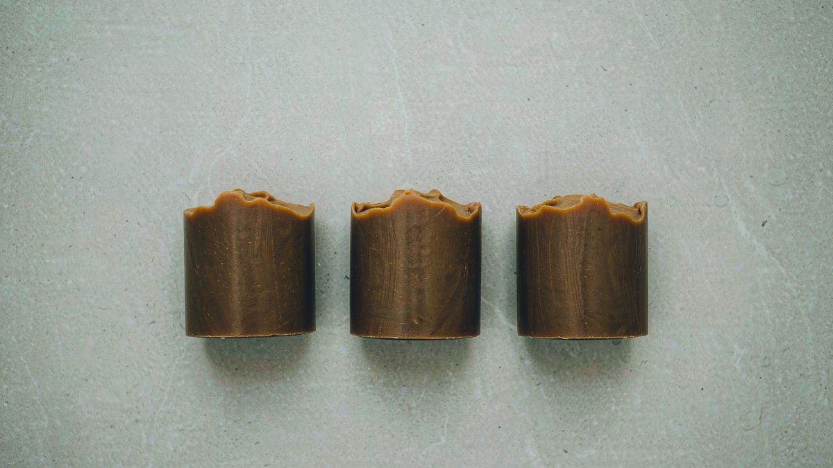 Three identical products arranged in a flat lay on a pale background