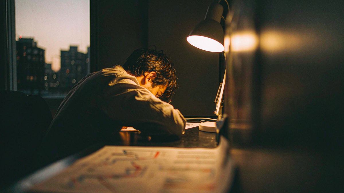 A person reviewing a printed chart at a desk before market open
