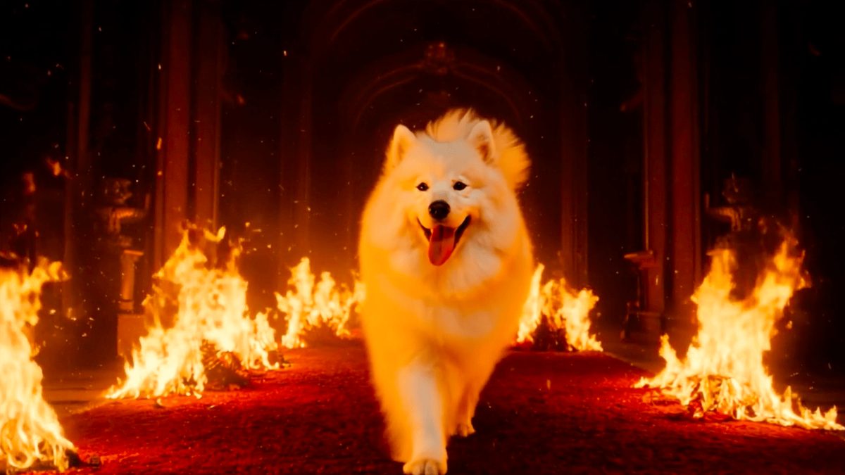 A person stepping onto a red carpet with warm flame-like lighting along the edges