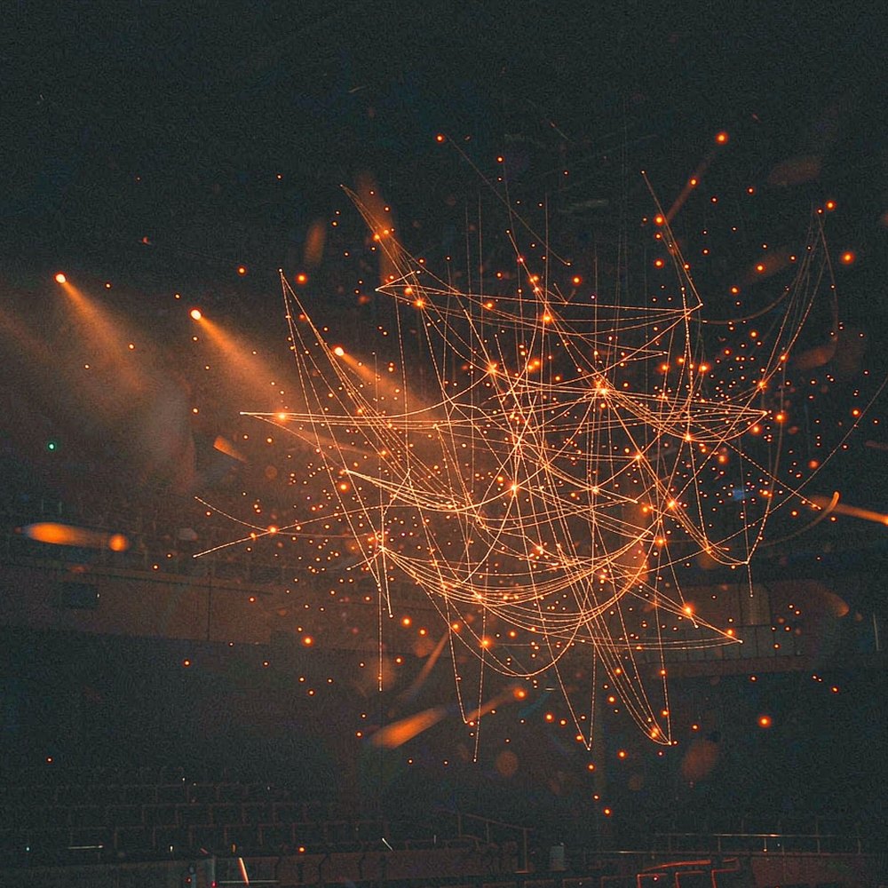 Glowing strings and light arcs suspended in a dark concert hall, representing the AI music and SFX generator by OpenFilmo